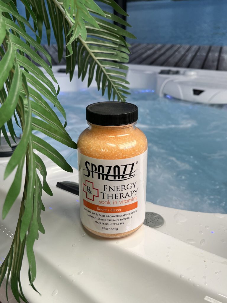 SpaZazz Energy Therapy crystals beside bubbling spa water, enhancing hot tubs in Topeka, Kansas.